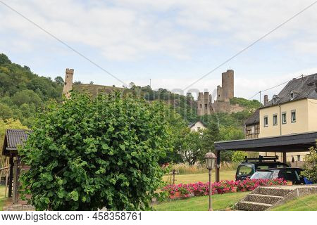 Castle Ruins Loewenburg And Philippsburg On A Hill Spur Above Eifel Village Of Monreal, Germany