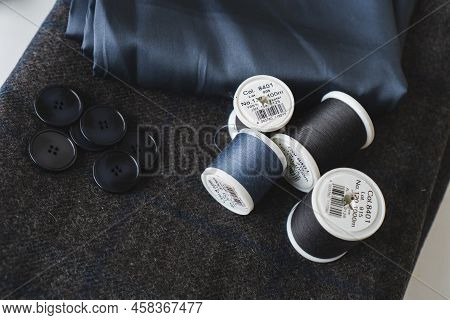 Sewing Items. Tailoring Scissors, Measuring Tape, Spools Of Thread, Patterns On Paper, Seamstress To