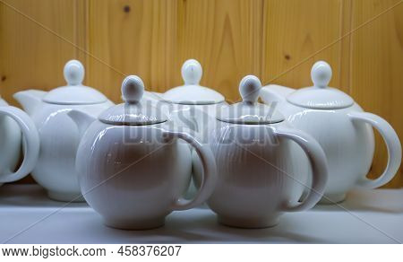 Many Coffee Pots Stand Side By Side In One Compartment.