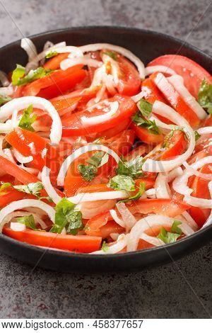 Ensalada Chilena Is A Chilean Salad Consisting Of Tomatoes, Onions, Olive Oil, And Coriander Closeup