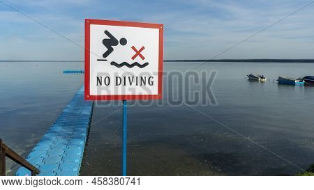 No Diving Sign At Beach, Lake Naroch, Belarus. Warning Sign Of Shallow Water. Warning Notice Sign Do