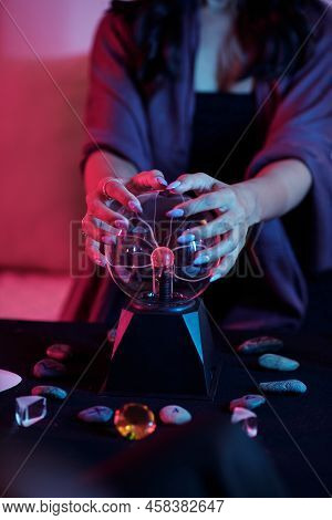 Young Woman Predicting Fate, Feeling Energy Of Crystal Ball In Dark Gothic Room, Future Telling And 