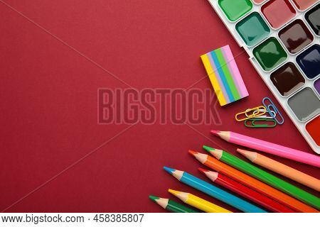 Different Stationery On Redbackground, Flat Lay With Space For Text.