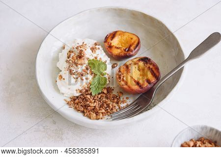 Summer Dessert. Organic Grilled Peaches Served With Stracciatella Cheese And Caramelized Nuts Crumb 