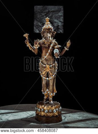 Bronze Figurine Of Lord Ganesha. Ganesha Is Hindu God Of Success That Artists And People Worship, Co