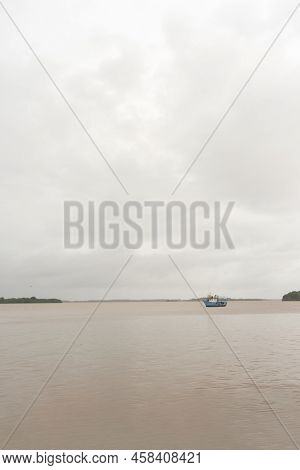 Vertical Photo Of Bluefields Bay In Nicaragua With A Cloudy Sky