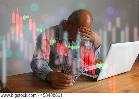 Senior Finansier Holding Dollar In Hand Working With Laptop In Sad Moment With Info Graphic Trend Gr
