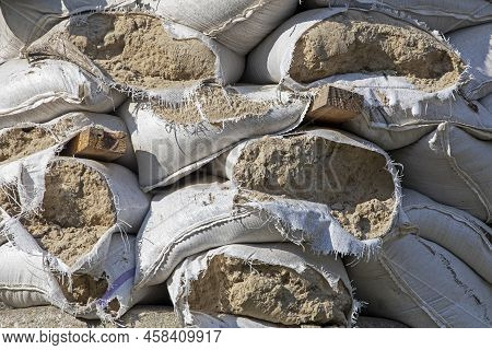 Close-up Of Torn Sandbags Furnished Around Historical Monuments And Roadblocks During Martial Law In