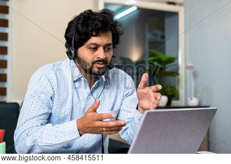 Corporate Employee Busy Attanding Meeting By Advising On Laptop At Office - Concept Of Customer Serv