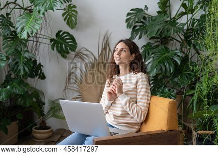 Pensive Woman Communicate With Boyfriend In Online App On Laptop Happy Thinking On Funny Text Messag