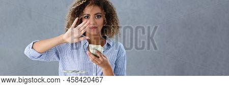 Portrait Of Latino American Young Woman Throwing Money Away From Hand, Bunch Of Cash. Rich Female An