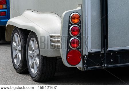 Fragment Of A Horse Trailer For A Car With Wheels And Taillights.  Vehicle For Horse Transportation 