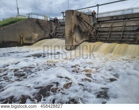 Dirty Brown Foamy Water In The River Nevezis City Panevezys Of Lithuania City Dam