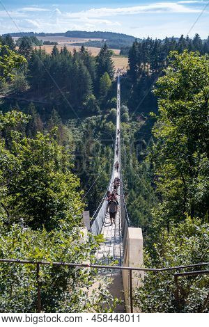 Moersdorf, Germany: August, 1. 2020: Geierlay Suspension Rope Bridge, A Pedestrian Rope Bridge Betwe