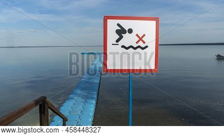 No Diving Sign At Beach, Lake Naroch, Belarus. Warning Sign Of Shallow Water. Warning Notice Sign Do