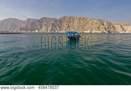Oman Fjords Sea Mountain Landscape, Dhow Boat, Oman, Khasab. Musandam Peninsula.