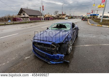 Hostomel, Kyev Region Ukraine - 09.04.2022: Shot Cars. On The Streets Of Irpin. Cities Of Ukraine Af