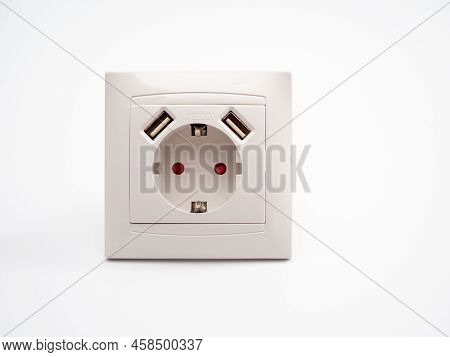 Universal European Standard Socket With Two Usb Connectors On A White Background.