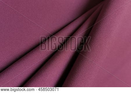 Pink Crumpled Or Wavy Fabric Texture Background. Abstract Linen Cloth Soft Waves. Gabardine Wool Fab