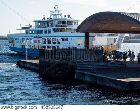 Hiroshima, Japan - August 24, 2018: Passengers And Vehicles Boarding Ninoshima Ferry Boat At Ujina P