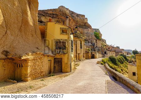 Old Houses Dug Into The Rock Of The Mountain In The Medieval Village Of San Esteban De Gormaz, Spain