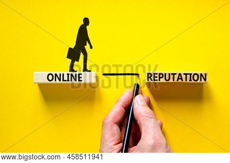 Online Reputation Symbol. Wooden Blocks With Concept Words Online Reputation On Beautiful Yellow Bac
