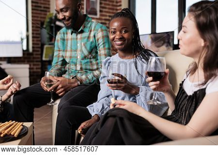 Happy Woman Smiling Heartily At Wine Party Held At Home While Drinking Alcoholic Beverage. Joyful Yo