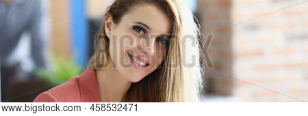 Portrait Of Attractive Blonde Lady Sit In Personal Cabinet Holding Glasses. Smiling Employee In Styl