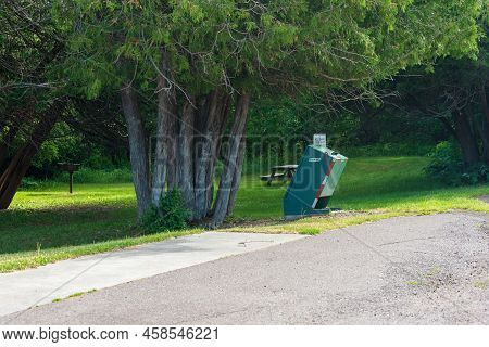 Eagle River, Mi - June 22, 2022: Animal Proof Trash Receptacle In Public Park