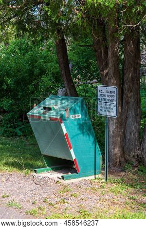 Eagle River, Mi - June 22, 2022: Animal Proof Trash Receptacle In Public Park