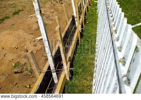 Constrcution Of New Fence, Summertime Outdoor Shot, Concept Of Neighbourhood