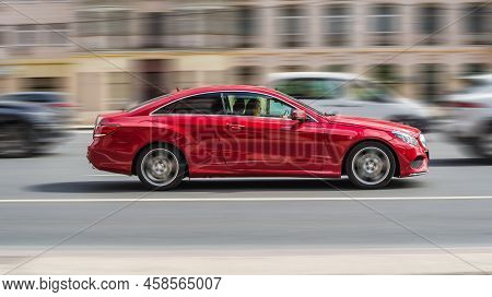 Moscow, Russia - July 2021: Mercedes E Class C207 Car On The Road In Motion. Fast Speed Drive On Cit