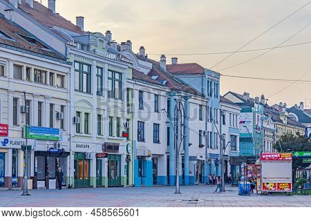 Cacak, Serbia - November 07, 2021: Tourist Organization Souvenir Shop At City Promenade Street Dusk 