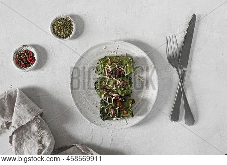 Rolls With Beet Leaves Served On The Plate With A Cutlary And . A Vegetarian Cooking, Top View, Copy