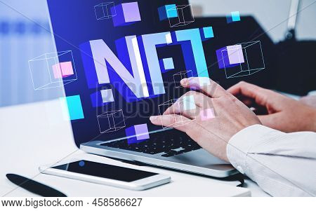 Businesswoman Fingers Typing On Laptop Computer, Digital Blocks With Nft Digital Hologram. Cryptoart
