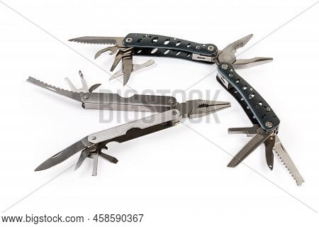 Two Different Multi-tools With Metal Handles And Partly Open Various Appurtenances On A White Backgr