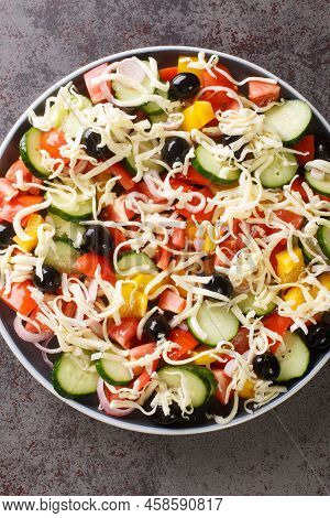 Serbian Salad Called Sopska Salata With Vegetables And Cheese Closeup In The Plate On The Table. Ver