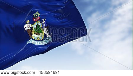 The Us State Flag Of Maine Waving In The Wind. Maine Is A State In The New England Region Of The Uni