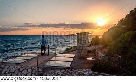 Photographer On The Coast Of Croatia During Sunset