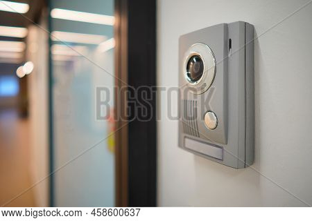Video Intercom System On White Wall To Enter Office. Intercum With A Camera In The Office. New Video