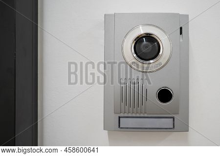 Video Intercom System On White Wall To Enter Office. Intercum With A Camera In The Office. New Video