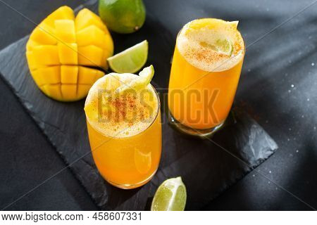 Mangonada Mexican Mango Smoothie With Chamoy Sauce And Chili Lime Seasoning And Tamarind Candy Straw