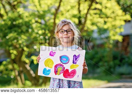 Little Preschool Girl Holding Picture Painted With Colorful Water Colors. Happy Child With Glasses, 