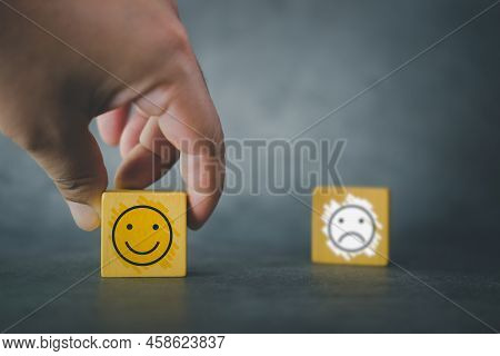 Close Up Customer Hand Choose Happy Smiley Face And Blurred Of Sad Face Icon On Wood Cube To Survey 