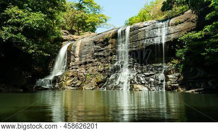 Beautiful Waterfall In Green Forest. Tropical Sera Ella Falls In Mountain Jungle, Sri Lanka.