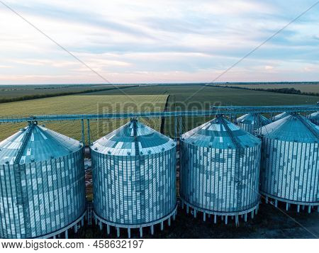 Grain Elevator. Metal Grain Elevator In Agricultural Zone. Agriculture Storage For Harvest. Grain Si