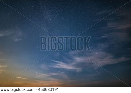 Beautiful Noctilucent Cloud Formations In Night Sky With Milky Way In The Background