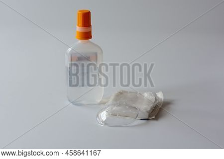 A Clear Plastic Protective Eye Shield , A Package Of Gauze And Normal Saline For Eye Cleaning After 