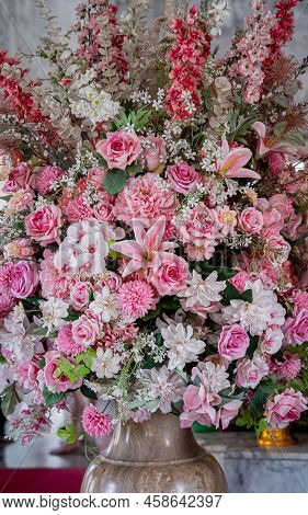 Big Bouquet Of Flowers In A Vase On A Gray Wall Background