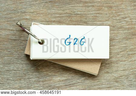 Flash Card With Handwriting Word G2g (abbreviation Of Government To Government) On Wood Background